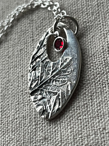 Pointed oval botanical printed silver necklace