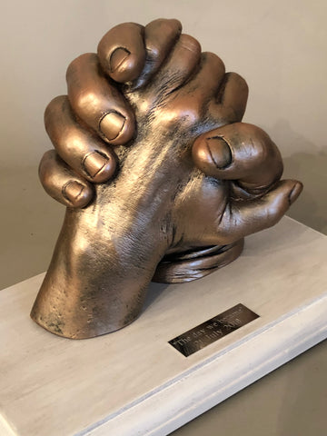 Hands clasped (2 adults)
