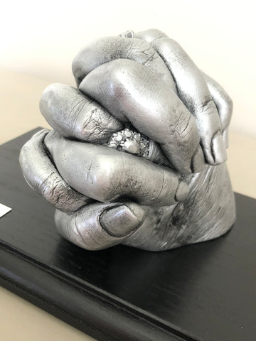 Hands clasped (2 adults)